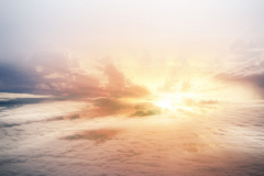 The sky bakground in Morning time,reflection of sunlight is shining to smoky waving cloud,beautiful top view,beauty by nature.